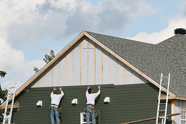 Professional Siding technician working in Somerset, TX